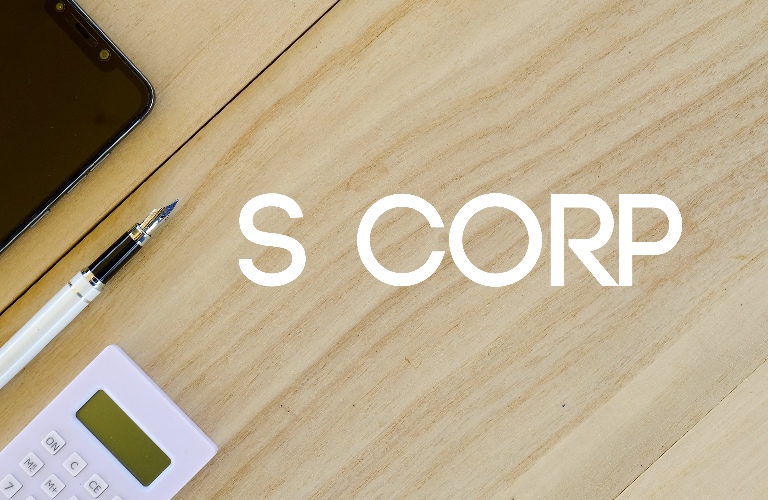 Top view of mobile phone,pen and calculator on wooden background written with S Corp